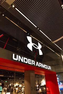 Under Armour retail store front in a shopping mall. London, UK, 10 February 2023 Stock Photos