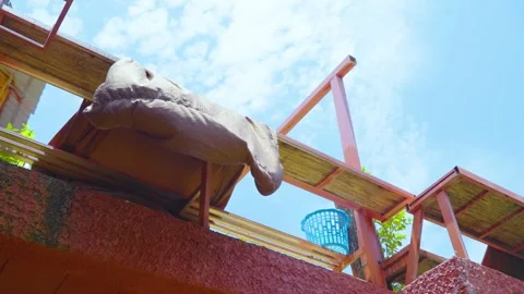 Under the blue sky, the breeze blows the blankets of old buildings to dry Stock Footage 313355916