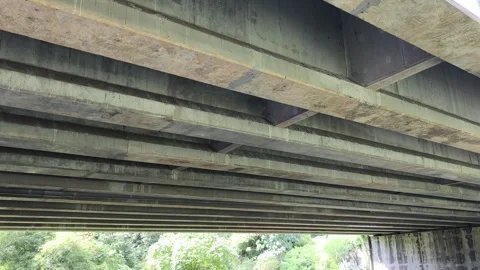 Under bridge beams, concrete supports Stock Footage 322956324