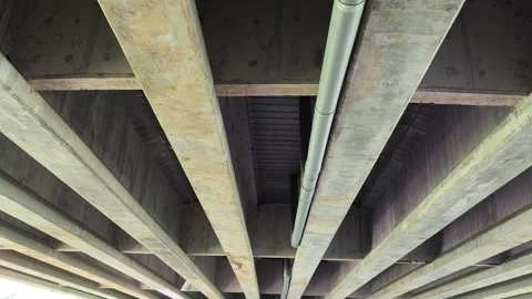 Under bridge beams, concrete supports Stock Footage 322956327