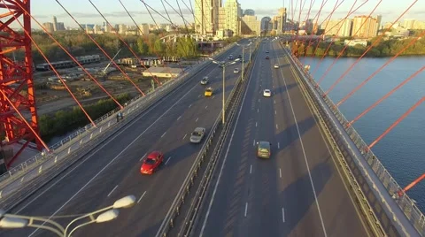 Under the bridge inside sunset moscow flying copter Stock Footage 55627829