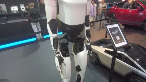 Under bright lights tesla optimus humanoid robot remains showcased upright Stock Footage 328207120