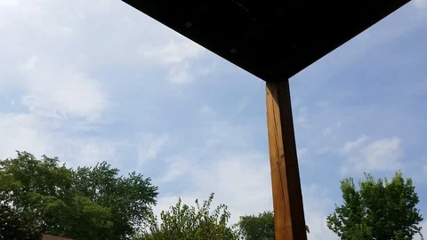 Under carport rolling clouds Stock Footage 94493606