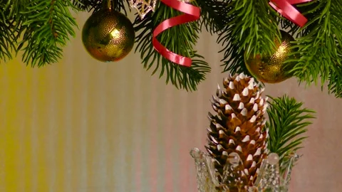 Under the Christmas tree branches, a beautiful Christmas cone rotates Stock Footage 216538237