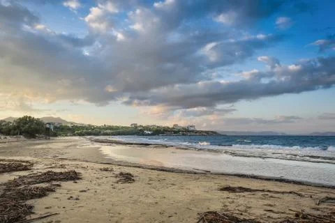 Under Cloudscape.View of a Beach at Rafina at Sunset, Greece. Stock Photos
