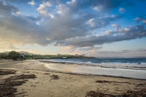 Under Cloudscape.View of a Beach at Rafina at Sunset, Greece. Stock Photos