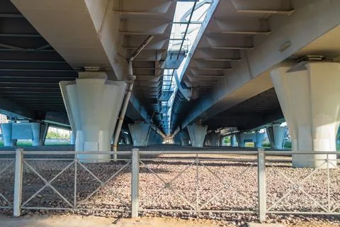 Under a concrete freeway, support beams. view from below Stock Photos