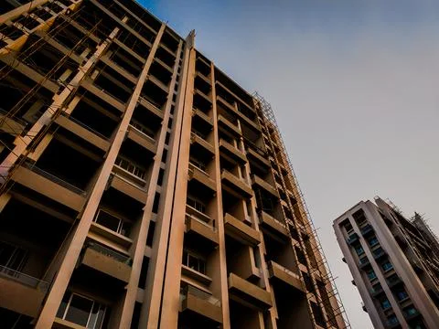 Under construction building from bottom angle with blue sky can be used as a  Stock-Fotos
