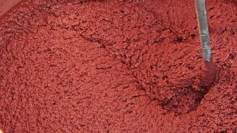 Under construction. Close-up of a mixer mixing material in a vessel. Preparation Stock Footage 292990498