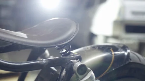 Under construction custom cafe racer bike overwiew Stock Footage 128920165