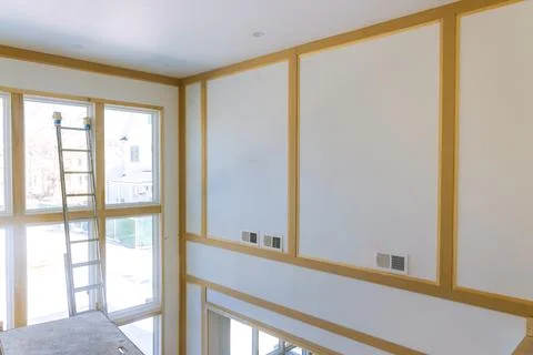 Under construction interior is installing drywall the room in new home Stock Photos