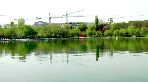 Under Construction Residential Complex Is Reflected In Pond Stock Footage 62070234