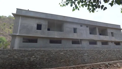 Under-Construction Rural Building with Stone Wall in Rajasthan Stock Footage 311002218