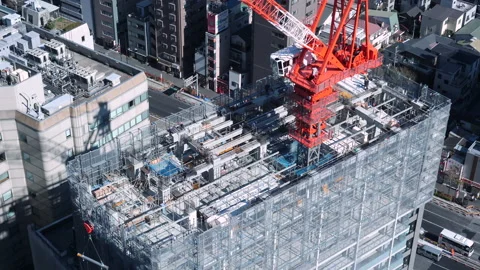 Under construction site, crane, and car traffic transportation in city downtown. Stock Footage 139636301