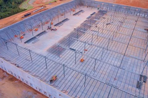 Under construction in warehouse, a steel structure roof truss frame is installed 스톡 사진
