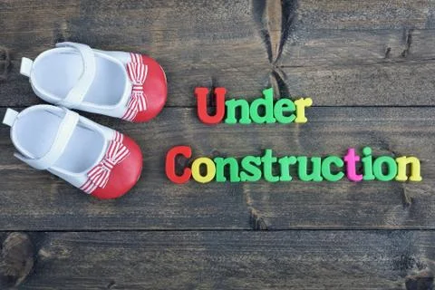 Under Construction on wooden table Photos