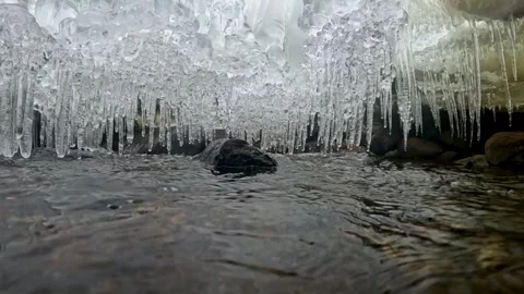 Under the Ice- Slow Motion Flowing Stream Beneath Winter River Ice at Ken Lo Stock Footage 341125603