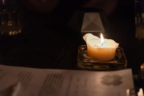 Under the light of a candle Stock Photos