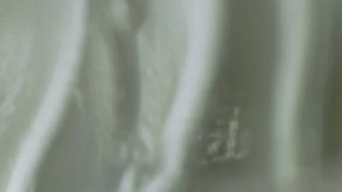 Under the magnification of microscope, the surface of plastic water bottle Stock Footage 142401179