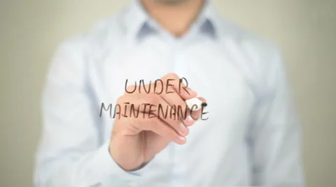 Under Maintenance, man writing on transparent screen Stock Footage 62764222