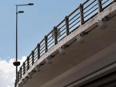 Under a modern road bridge. Outer side of the highway Stock Photos