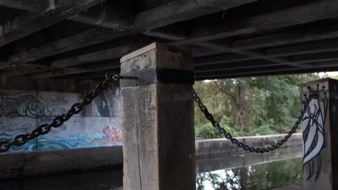 Under an overpass toe path chains Stock Footage 97096698