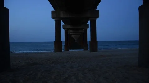 Under a Peer on the Beach Stock Footage 71247445