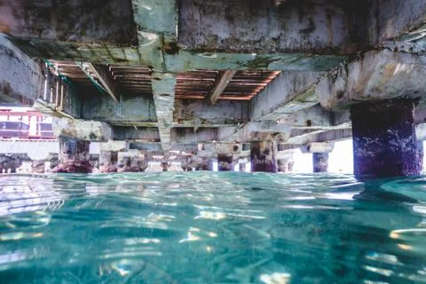 Under a Pier with Pillars and Structure Stock Photos