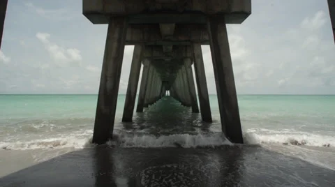 Under the Pier on a Sandy Beach Stock Footage 39512731