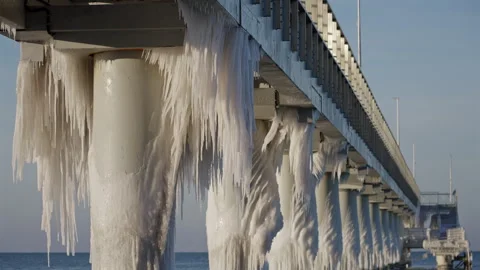 Under Pier View Of Ice Covered Pylons Stock Footage 327333445