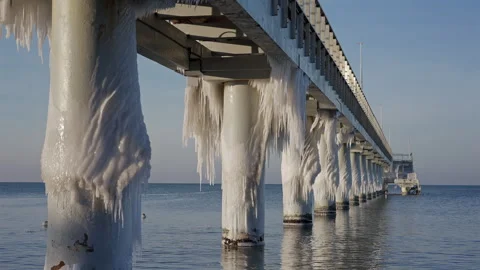 Under Pier View Of Ice Covered Pylons Stockbeeldmateriaal 327856619