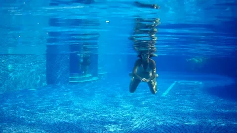 Under pool swimming Stock Footage 80367348