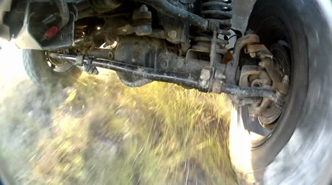 Under the off-road car while it is moving fast Stock Footage 34642205