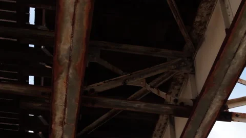 Under rusted and dirty elevated train tracks in Chicago's south side Stock Footage 165966564