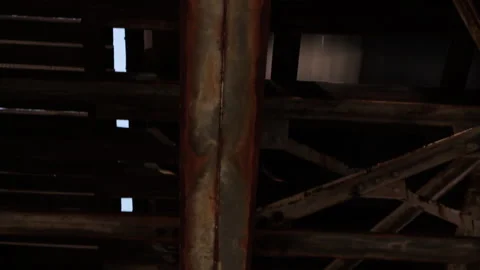 Under rusted and dirty elevated train tracks in Chicago's south side Stock Footage 165966595