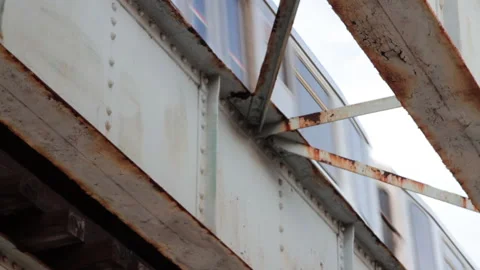 Under rusted and dirty elevated train tracks in Chicago's south side Stock Footage 165966647