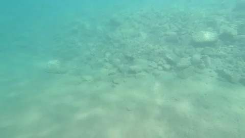 Under sea view with sun rays, sun beam, sands and rocks in Fethiye Stock Footage 247622230
