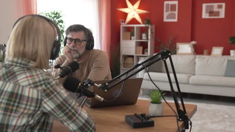 Under the shoulder view of mature man and woman record podcast at home Stock-Footage 303994154