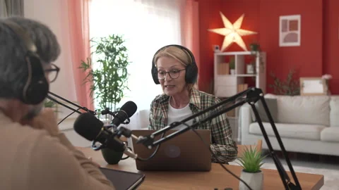 Under the shoulder view of mature man and woman record podcast at home Stock-Footage 303994410
