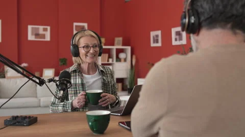 Under the shoulder view of mature man and woman record podcast at home Stock-Footage 303994691