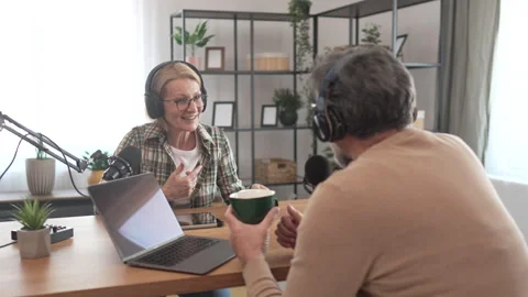 Under the shoulder view of mature man and woman record podcast at home Stock-Footage 303994910