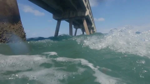Under South Side of Pier Waves Crashing Into Us Stock Footage 200798184