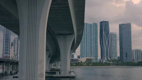 Under view of overpass highway in Miami Florida with skyline in background Stock Footage 258402527