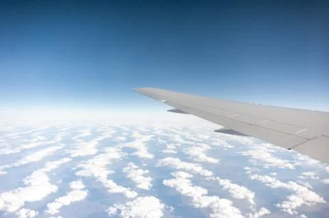 Under wing, the clouds, view from window Stock Photos