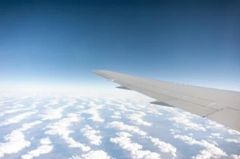 Under wing, the clouds, view from window Stock Photos