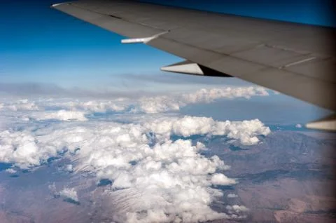 Under wing, the clouds, view from window Stock Photos