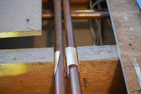 Underfloor copper pipework in a house 库存照片