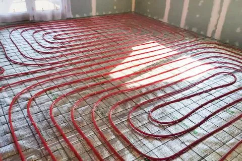 Underfloor heating system. Installation of underfloor heating. Stock Photos