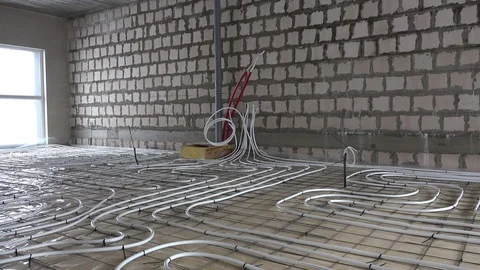 Underfloor heating system pipes tubes at construction site. Zoom in Stock Footage 119557764