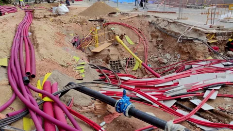 Underground cabling works.Smooth camera movement: Panning Right. Stock Footage 289320176